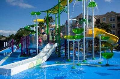 a water park with a water slide and a water park at Sunnyside Up Gated Resort Style Community in Orlando