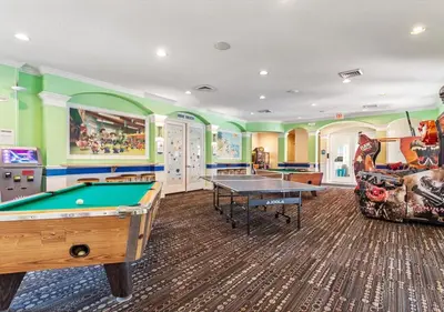 a games room with a pool table and a couch at Lilo and stitch Ohana Oasis in Kissimmee