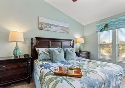 a bedroom with a bed with a tray on it at Lilo and stitch Ohana Oasis in Kissimmee