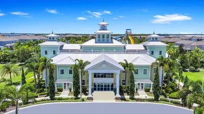 an aerial view of a large house with palm trees at Glorious Home Near Disney With Private Pool, Game Room And Waterpark & Resort Access At Encore Resorts Reunion - 660La in Kissimmee
