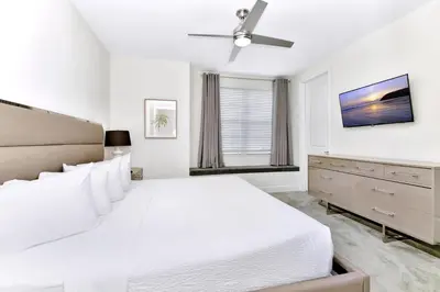 a white bedroom with a bed and a ceiling fan at Cheerful Home Near Disney With Private Pool, Themed Rooms And Waterpark & Resort Access At Encore Resorts Reunion - 7394Mr in Kissimmee