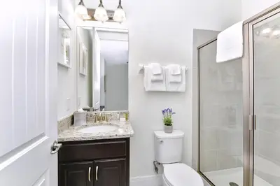 a bathroom with a toilet and a sink and a shower at Cheerful Home Near Disney With Private Pool, Themed Rooms And Waterpark & Resort Access At Encore Resorts Reunion - 7394Mr in Kissimmee