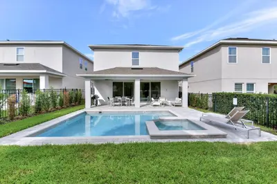 a backyard with a pool and a house at Cheerful Home Near Disney With Private Pool, Themed Rooms And Waterpark & Resort Access At Encore Resorts Reunion - 7394Mr in Kissimmee