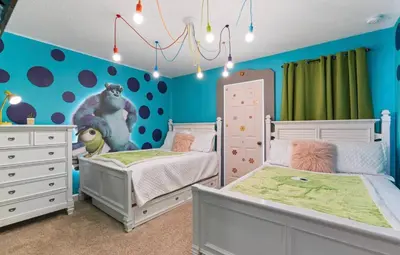 a childs bedroom with two beds and blue walls at Amazing 6Bdrms At Storey Lake- Close to Disney in Kissimmee