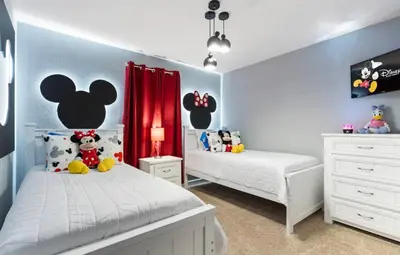 a bedroom with two twin beds and a mouse headboard at Amazing 6Bdrms At Storey Lake- Close to Disney in Kissimmee