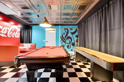 a billiard room with a pool table and a cocacola at South Facing Pool with Spa and a Game Room in Prime Location Near Disney in Kissimmee