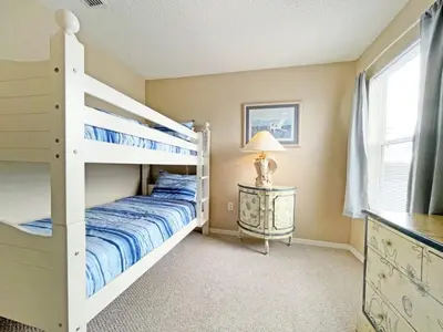 a bedroom with a bunk bed and a window at Sunnyside Villa home in Kissimmee