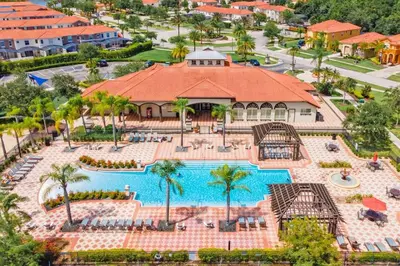 an aerial view of a pool at a resort at 6BR w Heated Pool + 9MI to Disney + Sleeps 14 in Kissimmee