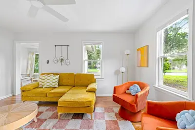 a living room with a couch and two chairs at Fire Pit + Grill + 2MI to DT Orlando in Orlando