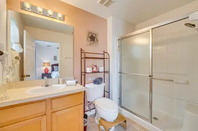 a bathroom with a shower and a toilet and a sink at 4 Mi to Disney Emerald Island Resort Home! in Kissimmee