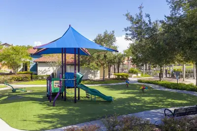 a playground with a slide in a park at Top Villas - Bella Vida Resort 203 in Kissimmee