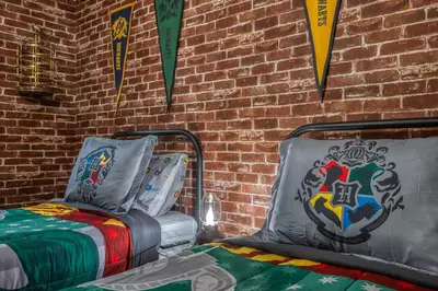 a room with two beds and flags on a brick wall at Last Minute Disney Getaway Private Pool Themed Bedrooms. Book Now 81935 in Orlando