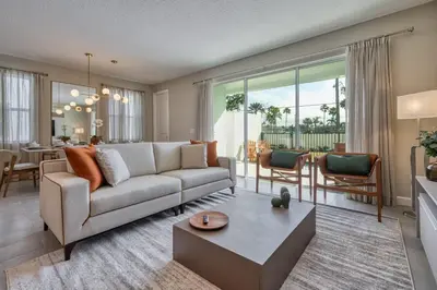 a living room with a couch and a table at Last Minute Disney Getaway Private Pool Themed Bedrooms. Book Now 81923 in Orlando