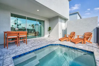 a house with a pool and a table and chairs at Last Minute Disney Getaway Private Pool Themed Bedrooms. Book Now 81919 in Orlando