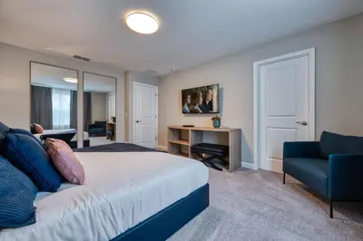 a bedroom with a bed and a desk and a chair at Last Minute Disney Getaway Private Pool Themed Bedrooms. Book Now 81921 in Orlando
