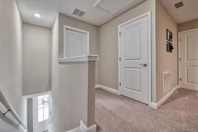 a hallway with a white door and a window at Last Minute Disney Getaway! Private Pool, Hot Tub & Games Room. Book Now! #81903 in Orlando