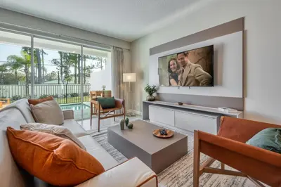 a living room with a couch and a tv at Last Minute Disney Getaway Private Pool Themed Bedrooms. Book Now 81945 in Orlando