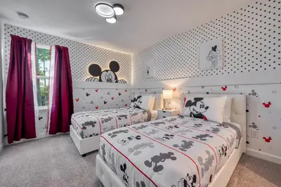 two beds in a bedroom with red curtains at Last Minute Disney Getaway Private Pool Themed Bedrooms. Book Now 95041 in Orlando