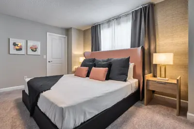 a bedroom with a large bed and a window at Last Minute Disney Getaway! Private Pool, Hot Tub & Games Room. Book Now! #81939 in Orlando