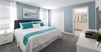 a bedroom with a large bed with blue walls at Last Minute Disney Getaway Private Pool Themed Bedrooms. Book Now 93749 in Kissimmee