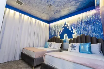 two beds in a room with a disney bedroom at Last Minute Disney Getaway Private Pool Themed Bedrooms. Book Now 99589 in Kissimmee