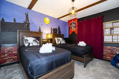 a bedroom with two beds and a castle mural at Storey Lake Resort 1082 - Hosted by Top Villas in Kissimmee