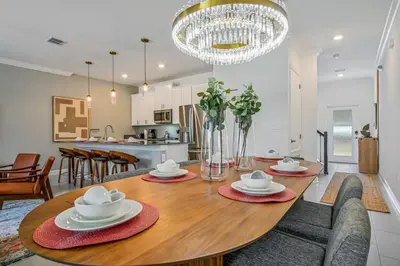 a dining room and kitchen with a table and chairs at Storey Lake Resort 1088 - Hosted by Top Villas in Kissimmee