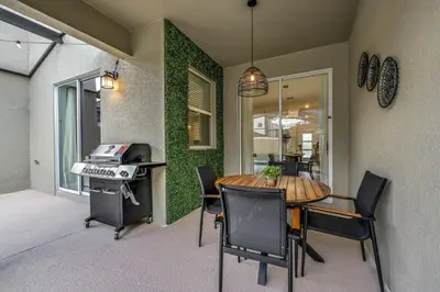 a dining room with a table and chairs at Storey Lake Resort 1088 - Hosted by Top Villas in Kissimmee