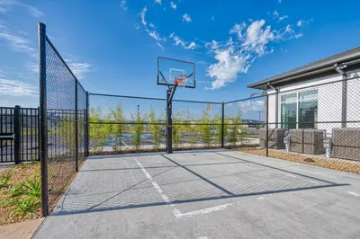 a basketball court with a hoop on a fence at Storey Lake Resort 1088 - Hosted by Top Villas in Kissimmee