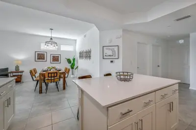 a kitchen and dining room with a dining table at Storey Lake Resort 1099 - Hosted by Top Villas in Kissimmee