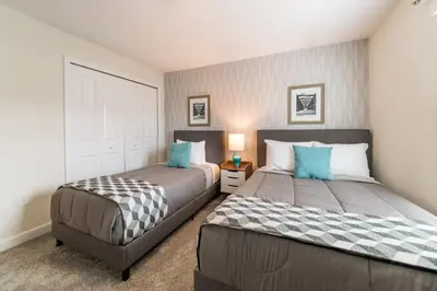 two beds in a room with two beds sidx sidx sidx sidx at Storey Lake Resort 1107 - Hosted by Top Villas in Kissimmee