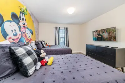 a bedroom with two beds with stuffed animals on them at Last Minute Disney Getaway Private Pool Themed Bedrooms. Book Now 98613 in Kissimmee