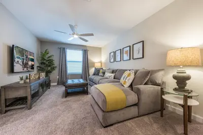 a living room with a couch and a table at Storey Lake Resort 61 - Hosted by Top Villas in Kissimmee