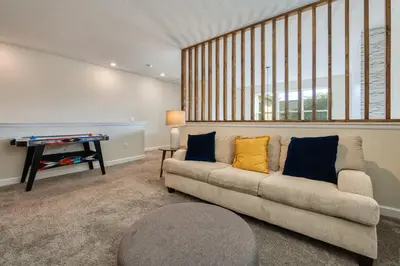 a living room with a couch and a table at Last Minute Disney Private Pool Hot Tub Themed Bedrooms. Book Now 54267 in Kissimmee