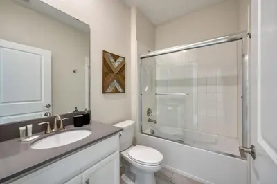 a bathroom with a toilet and a sink and a shower at Last Minute Disney Private Pool Hot Tub Themed Bedrooms. Book Now 54267 in Kissimmee