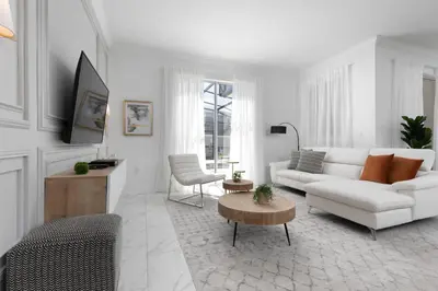 a white living room with a white couch and a table at Last Minute Disney Getaway Private Pool Themed Bedrooms. Book Now 58079 in Kissimmee