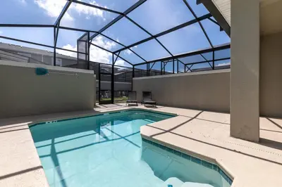 an indoor swimming pool with a glass roof at Last Minute Disney Getaway Private Pool Themed Bedrooms. Book Now 58079 in Kissimmee