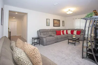 a living room with a couch and a table at Last Minute Disney Getaway Villa with Private Pool Hot Tub. Book Now 22454 in Kissimmee