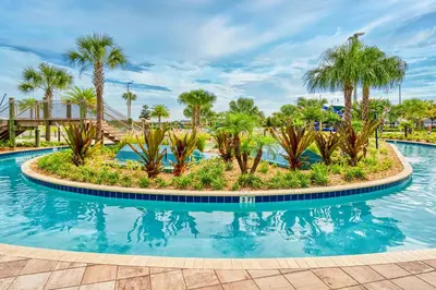 a pool at a resort with palm trees at Last Minute Disney Getaway Villa with Private Pool Hot Tub. Book Now 22454 in Kissimmee