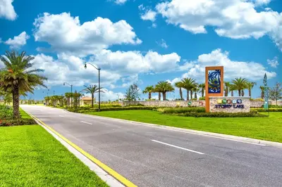 an empty road with palm trees on the side at Last Minute Disney Getaway Townhouse with Private Pool. Book Now 17402 in Kissimmee