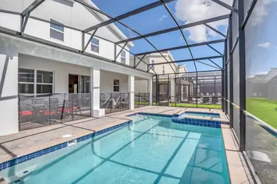 a swimming pool in a house with a glass ceiling at Storey Lake Resort 972 - Hosted by Top Villas in Kissimmee