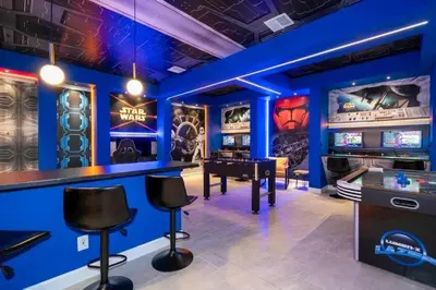 a game room with a pool table and consoles at Last Minute Disney Private Pool Hot Tub Game Room Themed Bedrooms. Book Now 90505 in Kissimmee