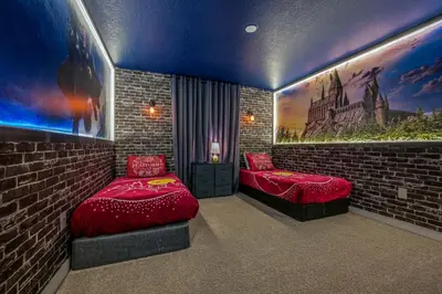 a bedroom with two beds and a brick wall at Last Minute Disney Getaway Private Pool Themed Bedrooms. Book Now 91409 in Kissimmee