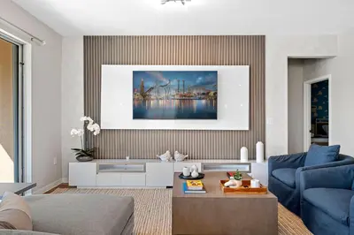 a living room with a blue couch and a painting at Veranda Palms 8 Bedroom Home with Pool2208 in Kissimmee