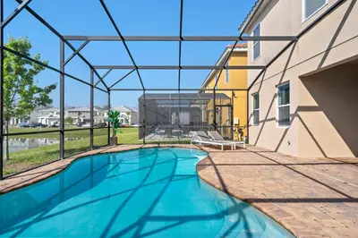 a swimming pool in the middle of a building at Veranda Palms 8 Bedroom Home with Pool2208 in Kissimmee