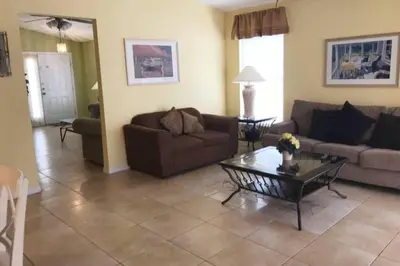 a living room with a couch and a coffee table at 4br/3ba Disney Area Luxury Resort with pool/spa in Orlando