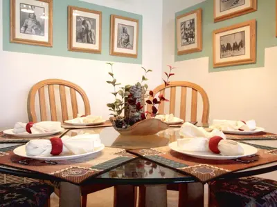 a dining room table with chairs and plates on it at 4 Bed 2269 in Kissimmee