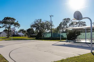 an empty basketball court with a basketball hoop at Disney and Airport 15 minutes from Luxury Condo in Orlando