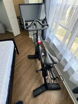 a room with a chair and a computer monitor at Disney and Airport 15 minutes from Luxury Condo in Orlando