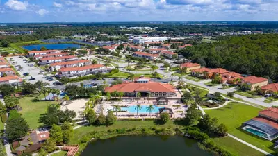 an aerial view of a resort with a large building at Family-Friendly Luxury Home Near Disney & More in Kissimmee